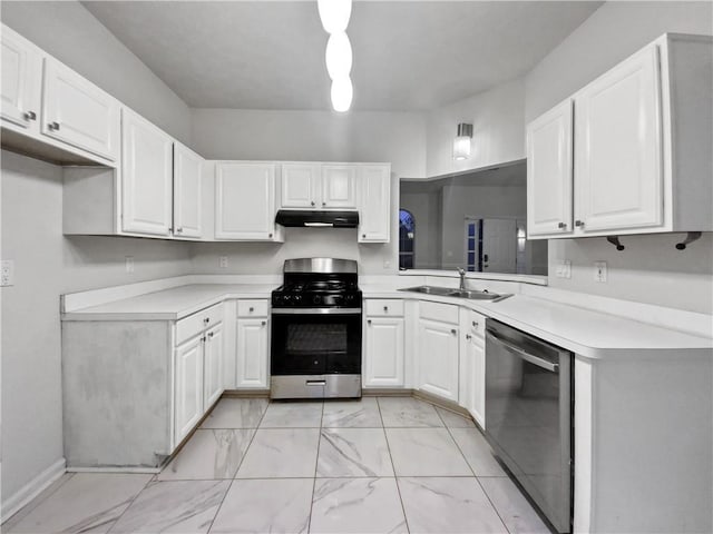 kitchen featuring sink, appliances with stainless steel finishes, and white cabinetry