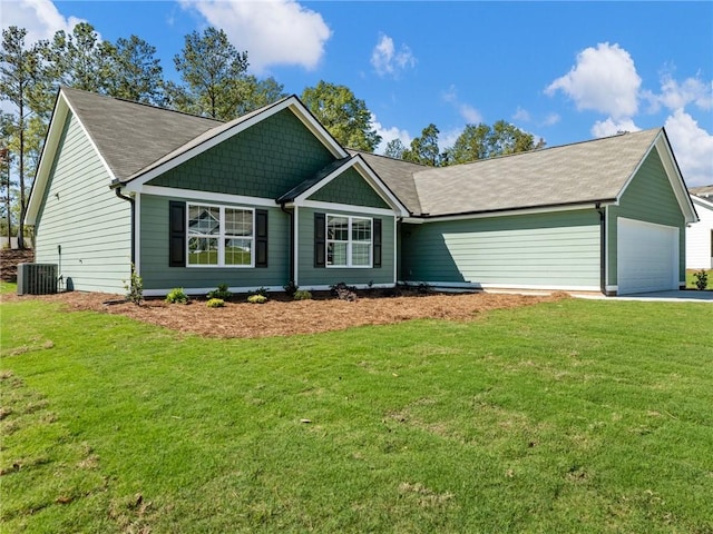 view of front of home featuring a garage, concrete driveway, a front lawn, and central air condition unit