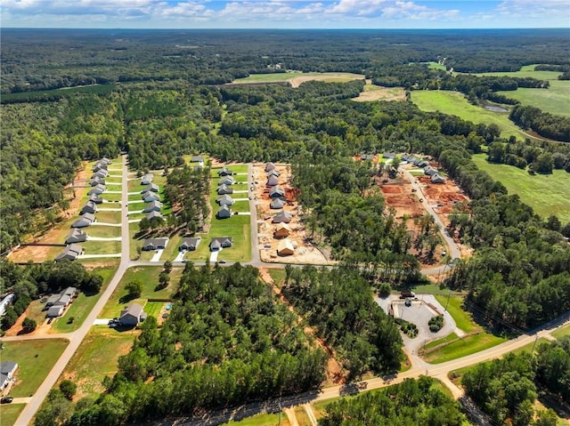 birds eye view of property with a wooded view