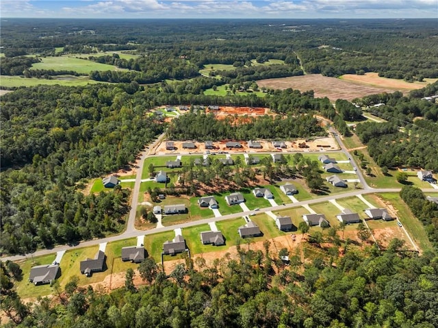 aerial view with a wooded view