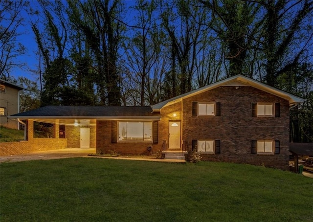 split level home with a front yard