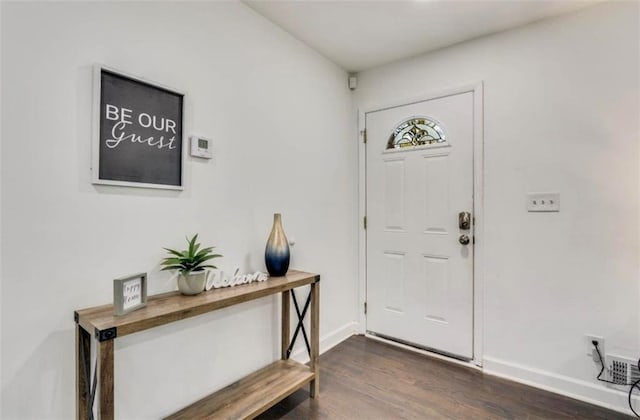 foyer entrance with dark hardwood / wood-style floors