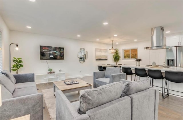 living room with light hardwood / wood-style floors