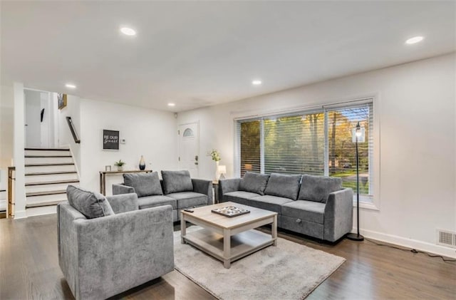 living room featuring dark hardwood / wood-style flooring