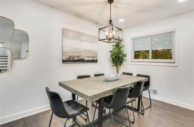 dining area featuring dark wood-type flooring