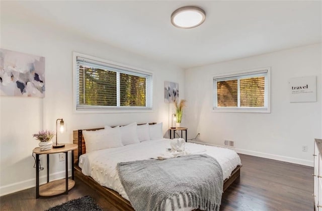 bedroom featuring dark wood-type flooring