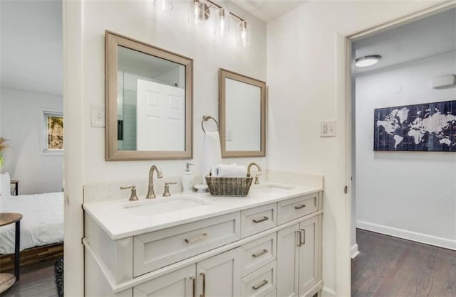 bathroom with vanity and hardwood / wood-style floors