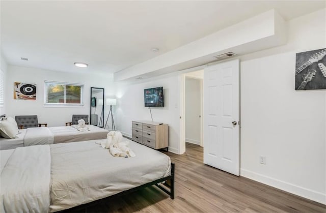 bedroom featuring hardwood / wood-style floors