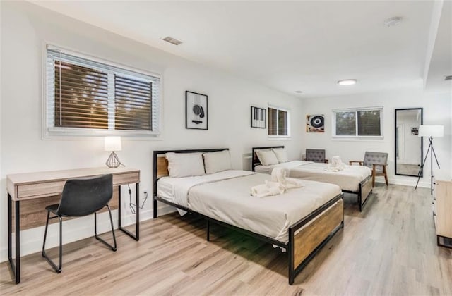 bedroom with light wood-type flooring