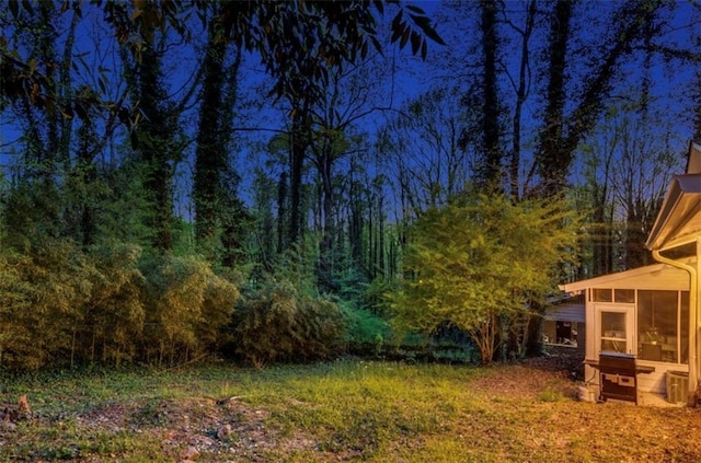 view of yard featuring a sunroom