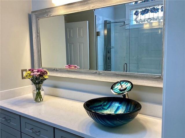 bathroom featuring vanity and a stall shower