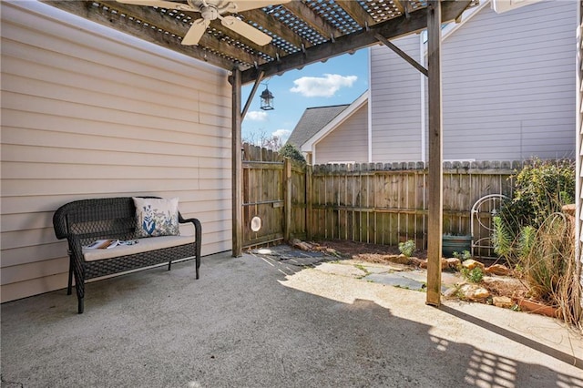 view of patio / terrace featuring a ceiling fan, fence, and a pergola