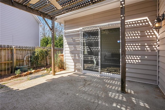 exterior space with a pergola and fence