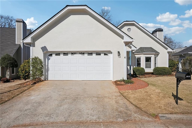 ranch-style house featuring a chimney, stucco siding, concrete driveway, a front lawn, and a garage