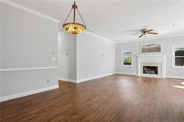 unfurnished living room with dark wood-style floors, a fireplace, and crown molding