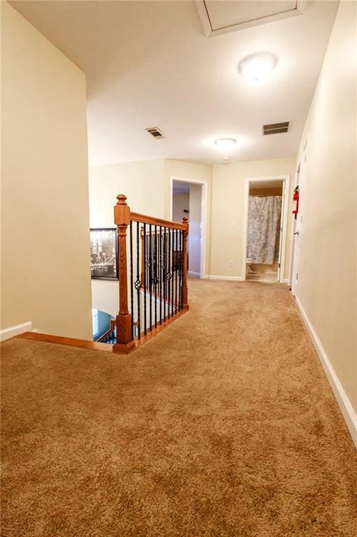 corridor with carpet floors