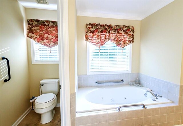 bathroom with toilet, tile patterned flooring, tiled tub, and ornamental molding