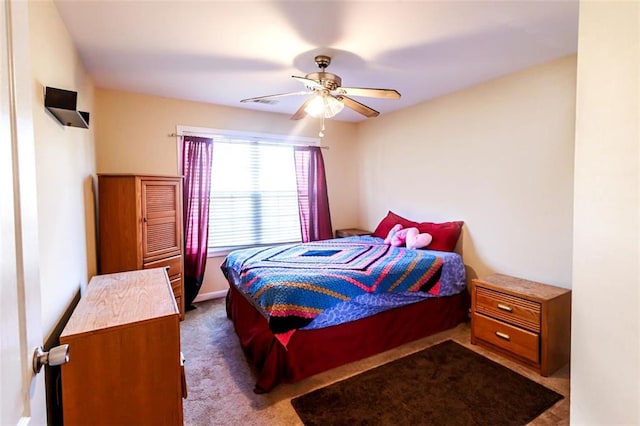 bedroom featuring ceiling fan and carpet floors