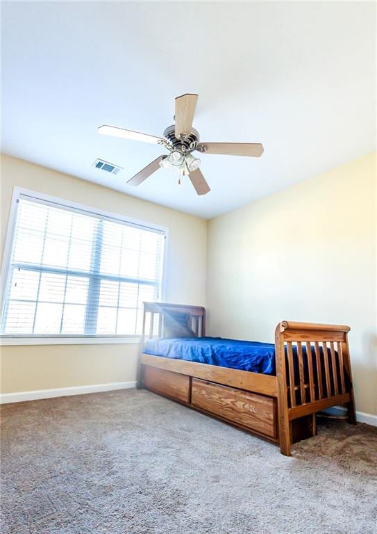 carpeted bedroom featuring ceiling fan