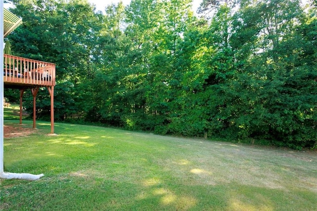 view of yard with a wooden deck