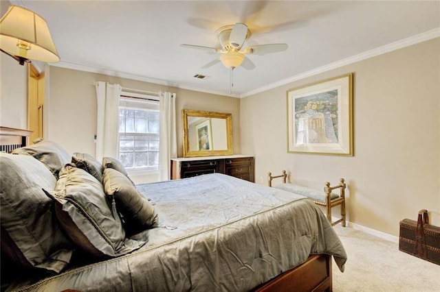 bedroom featuring ceiling fan, visible vents, baseboards, ornamental molding, and carpet