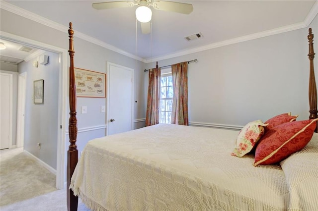 bedroom with light colored carpet, a ceiling fan, baseboards, visible vents, and crown molding