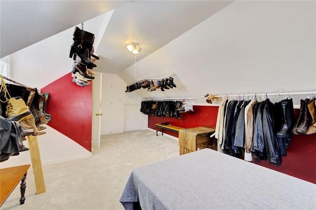 bedroom featuring carpet floors and vaulted ceiling