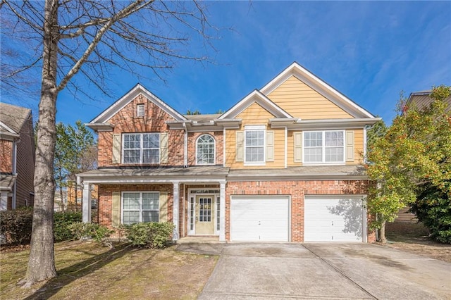 view of front of house featuring an attached garage, brick siding, and driveway