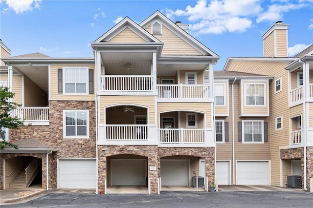 426 Pembrooke Cir Unit 426, Alpharetta, GA 30004 - view of property with a garage, central AC unit, and driveway