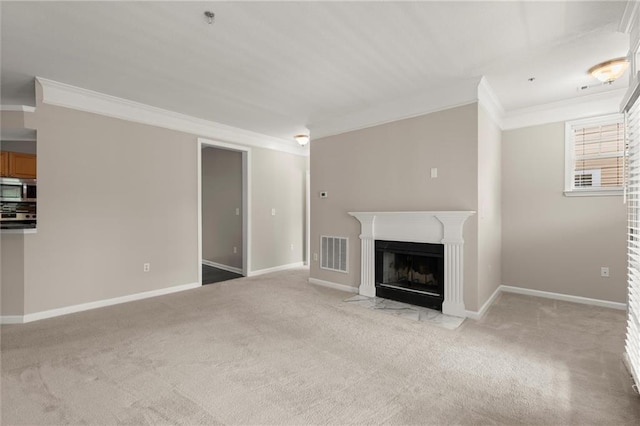 426 Pembrooke Cir Unit 426, Alpharetta, GA 30004 - unfurnished living room featuring ornamental molding, light carpet, a fireplace with flush hearth, and baseboards