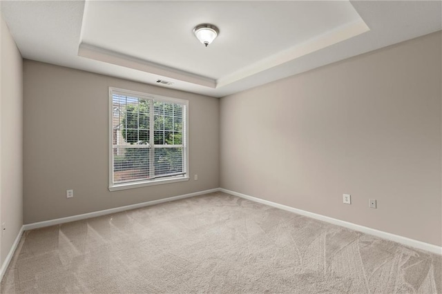 426 Pembrooke Cir Unit 426, Alpharetta, GA 30004 - unfurnished room with a tray ceiling, carpet floors, and baseboards