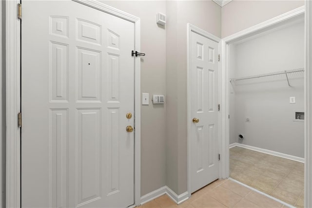 426 Pembrooke Cir Unit 426, Alpharetta, GA 30004 - laundry room featuring electric dryer hookup, baseboards, and light tile patterned floors