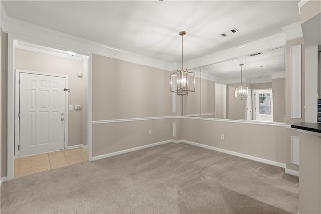 426 Pembrooke Cir Unit 426, Alpharetta, GA 30004 - unfurnished dining area featuring carpet, crown molding, a chandelier, baseboards, and tile patterned floors