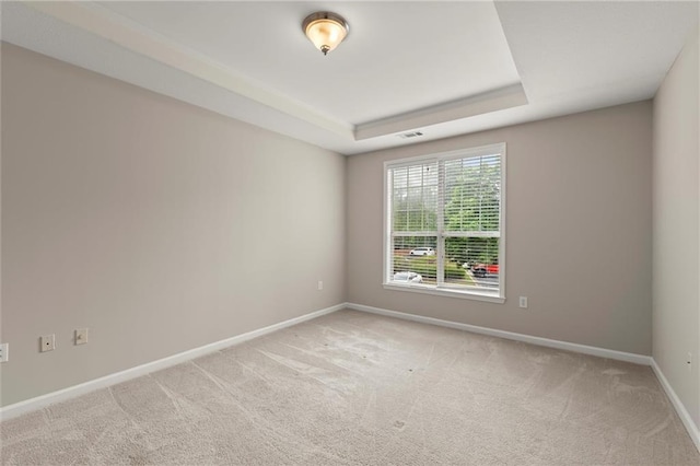 426 Pembrooke Cir Unit 426, Alpharetta, GA 30004 - empty room with light carpet, baseboards, and a raised ceiling