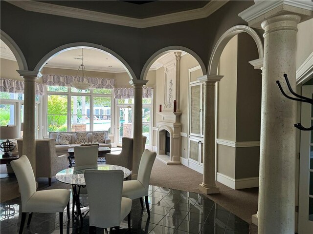 426 Pembrooke Cir Unit 426, Alpharetta, GA 30004 - dining room featuring decorative columns, crown molding, and granite tiled floors