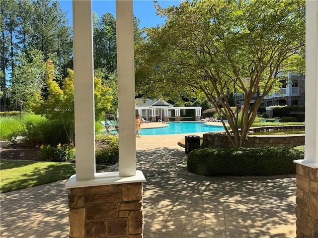 426 Pembrooke Cir Unit 426, Alpharetta, GA 30004 - community pool featuring a patio area