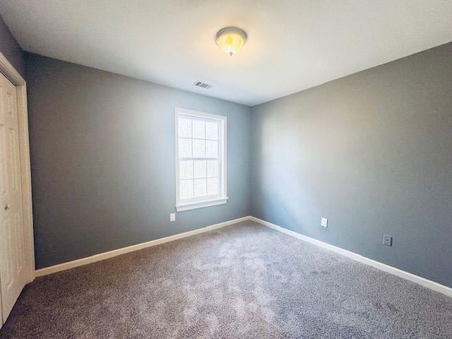 empty room featuring carpet floors