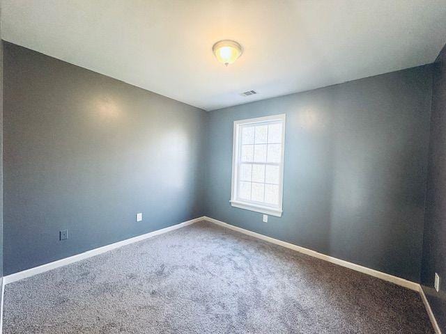 unfurnished room with carpet