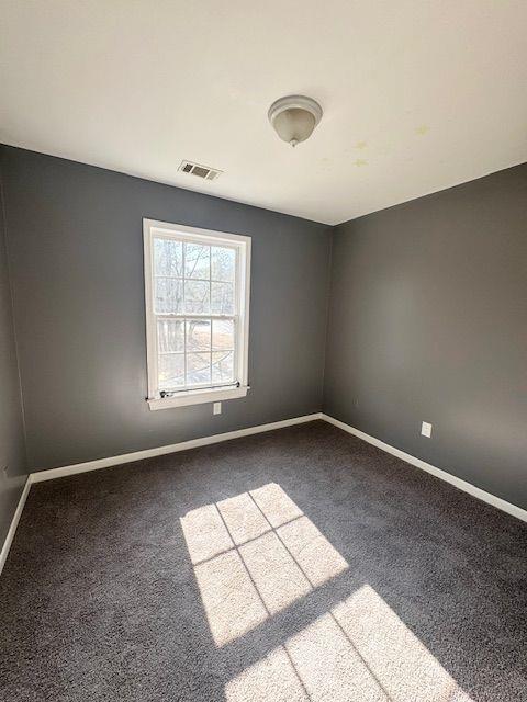 unfurnished room featuring carpet flooring