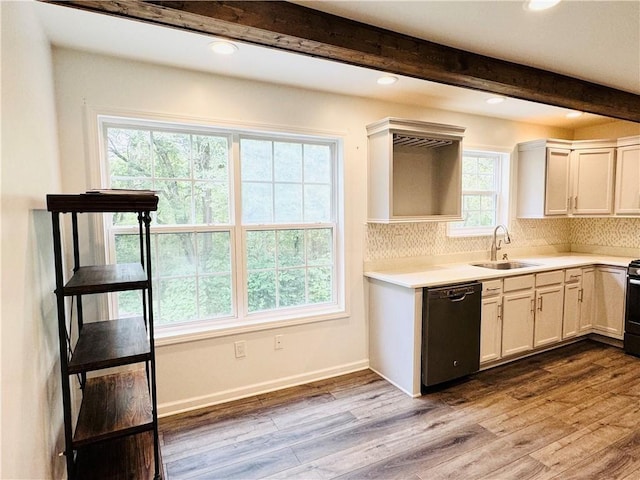 kitchen with dishwasher, sink, white cabinets, light hardwood / wood-style floors, and beam ceiling