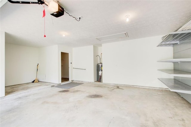 221 Glenview Trl, Griffin, GA 30224 - garage with a garage door opener and electric water heater