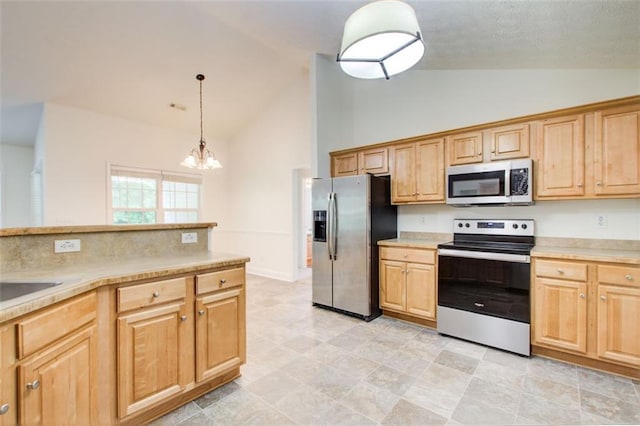 221 Glenview Trl, Griffin, GA 30224 - kitchen with appliances with stainless steel finishes, high vaulted ceiling, a chandelier, and light countertops