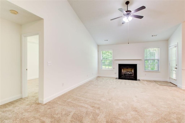 221 Glenview Trl, Griffin, GA 30224 - unfurnished living room featuring carpet, a fireplace with flush hearth, a ceiling fan, and lofted ceiling