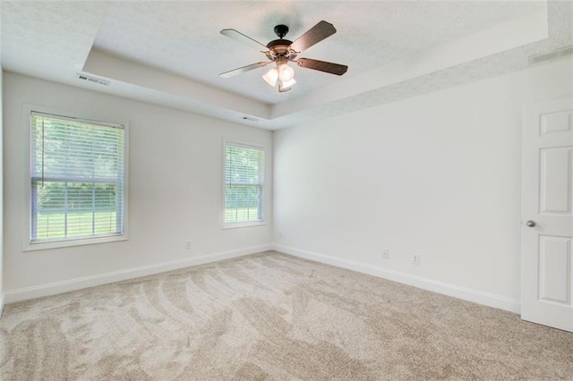 221 Glenview Trl, Griffin, GA 30224 - carpeted empty room with a raised ceiling, a ceiling fan, and a textured ceiling