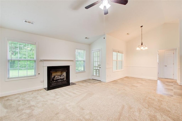 221 Glenview Trl, Griffin, GA 30224 - unfurnished living room featuring a fireplace with flush hearth, ceiling fan, light colored carpet, a chandelier, and lofted ceiling