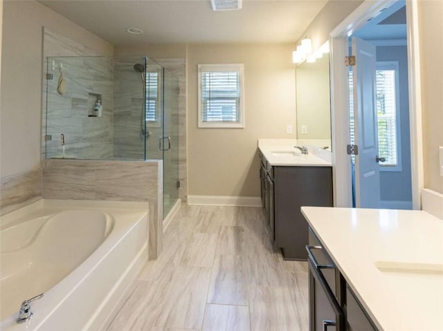 360 Hayden Cir, Woodstock, GA 30189 - bathroom with a stall shower, a bath, vanity, and baseboards