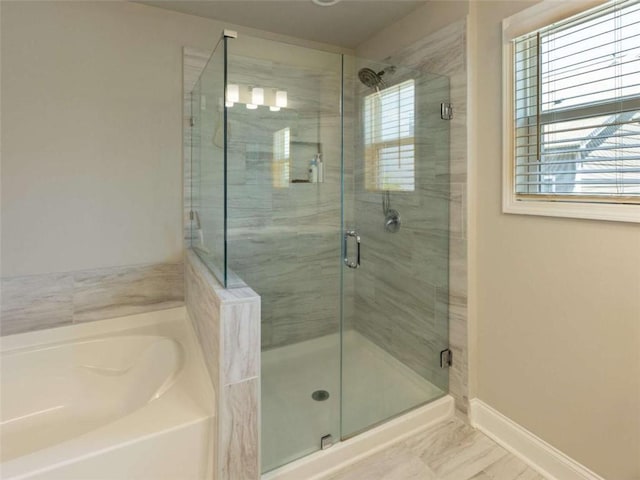 360 Hayden Cir, Woodstock, GA 30189 - full bathroom with a garden tub, plenty of natural light, a shower stall, and baseboards
