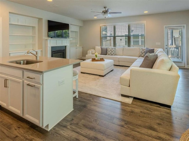 360 Hayden Cir, Woodstock, GA 30189 - living area featuring a glass covered fireplace, recessed lighting, healthy amount of natural light, and dark wood-style flooring