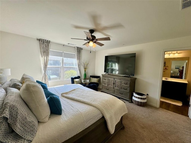 1606 Larkspur Trl, Conyers, GA 30012 - carpeted bedroom with a ceiling fan, connected bathroom, and baseboards