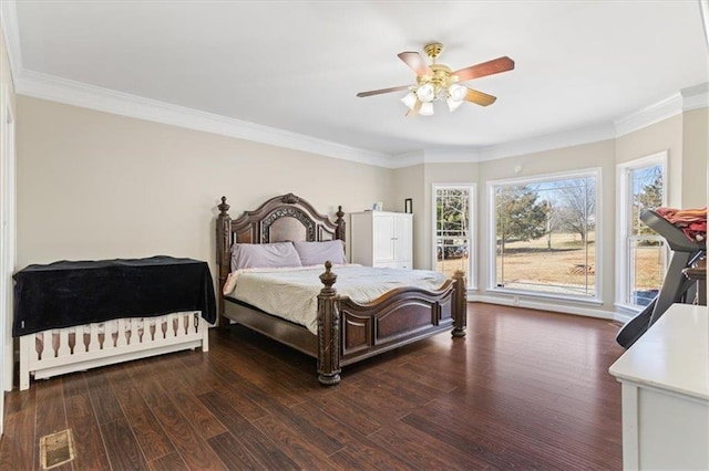 bedroom with ceiling fan, dark wood-style flooring, and crown molding